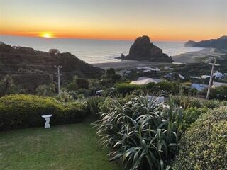 Double Koru birdbath at Piha