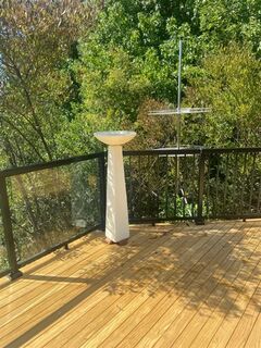 Modern birdbath on deck